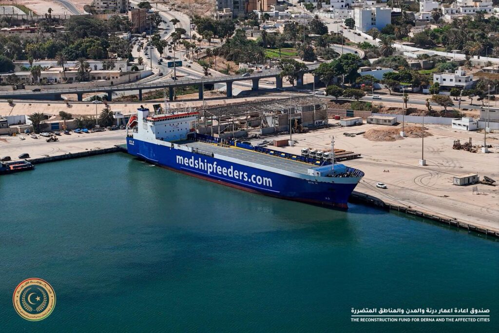 A large shipment of Turkish basalt tiles arrives in Derna seaport to be used for its newly constructed coastal sidewalk, 25 September 2025. (Derna Reconstruction Fund photo)