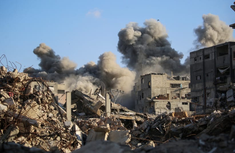 Smoke billows following an Israeli strike that targeted a building in the Bureij camp for Palestinian refugees in the central Gaza Strip on October 19, 2025. (AFP via Getty Images photo)