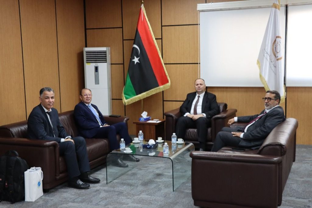 GACI's Chairman Abdulbaset Albaour, center, and AICTO's Director Mohamed Bin Omar meeting in Tripoli, 16 November 2025. (GACI photo)