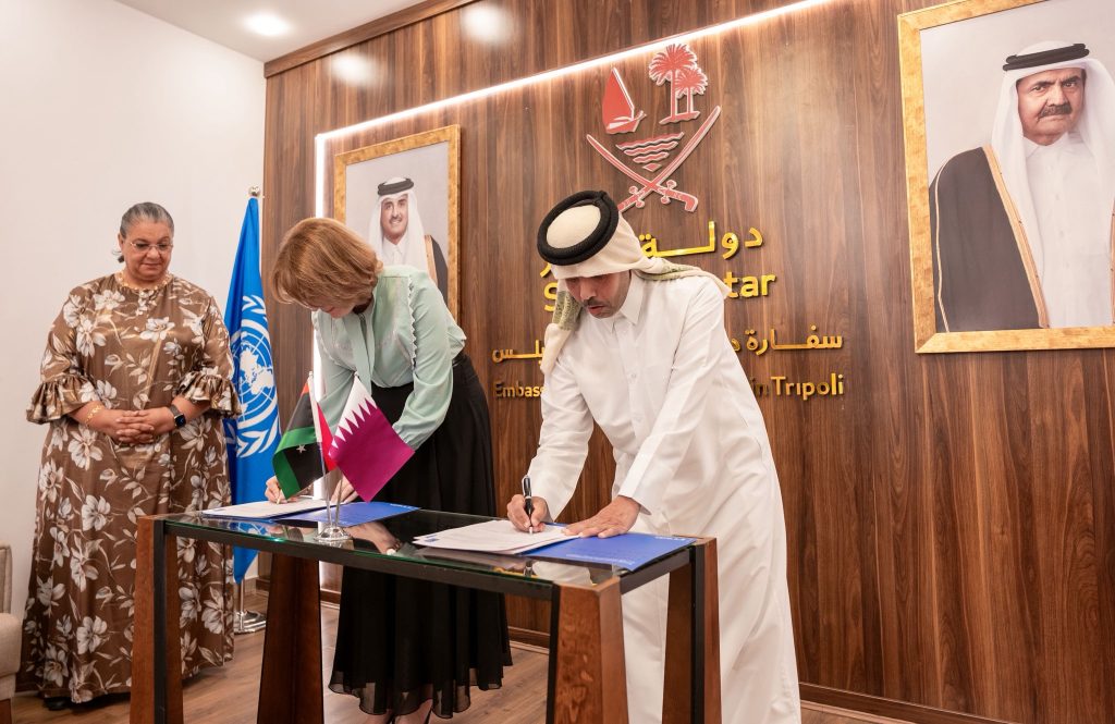 SRSG Hanna Tetteh, center, is seen her with Khaled Al Dosari, Ambassador of the State of Qatar, and Sophie Kemkhadze, UNDP Resident Representative in Libya, after signing a questionable funding agreement related to a ‘Libyan-led, Libyan-owned’ political dialogue. 17 November 2025. (UNSMIL photo)